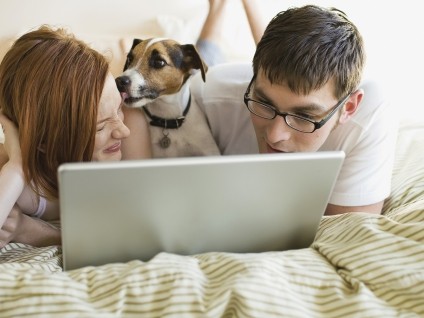 Couple with Dog on Laptop
