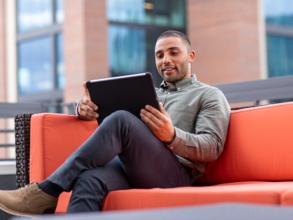 Man looking at tablet